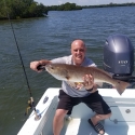 Barry with an over slot Red Fish caught with Capt. Wes Wildman out of Island Discount Tackle