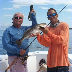 Paul Keyes tips his hat to this beautiful fall Tampa Bay redfish.